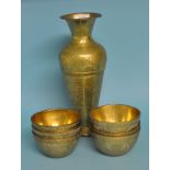 A set of six Javanese brass bowls, 11 cm diameter, and a similar vase,