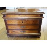 A 19th century French box, in the form of a commode chest of drawers, on bun feet,