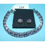 A silver and amethyst line bracelet,