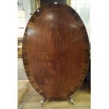 A George III style inlaid mahogany oval breakfast table, on a pedestal base,