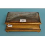 A copper and oak box, made from material from The Royal George, which served as the Royal Yacht of