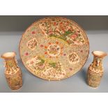 A Chinese famille rose porcelain charger, 47 cm diameter, a pair of similar vases, 26 cm high, and