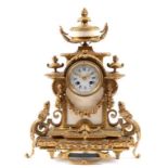 A late 19th century mantel clock, the 9 cm enamel dial with Roman numerals,