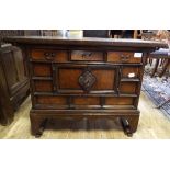 A Chinese cabinet, of small proportions, with three frieze drawers and a pair of panel doors, 78.