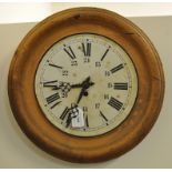 A Continental wall clock, in a simulated wood frame,