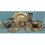 Two silver plated bottle holders, a plate on copper oval dish, with embossed decoration,