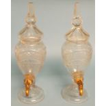 A pair of cut glass brandy decanters,