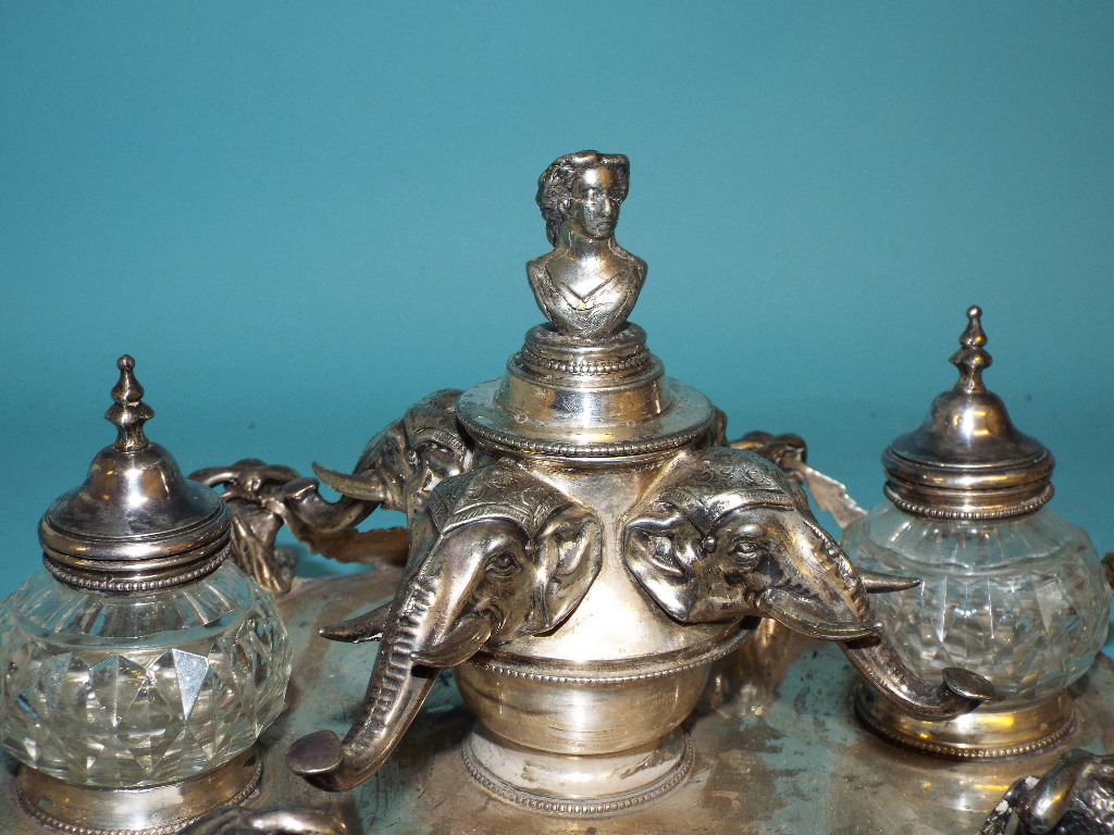 A Victorian silver plated ink stand, the central well with four elephant masks, flanked by a pair of - Image 9 of 9