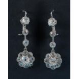 A pair of white coloured metal and diamond drop earrings,