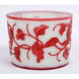 A Chinese red and white glass vase, decorated fruit, leaves and fauna, 11 cm high  See