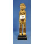 A Lobi carved wooden figure,