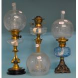 A Victorian oil lamp, with blue glass reservoir, and etched glass shade, 52 cm high,