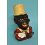 A painted cast iron Jolly Negro money box,