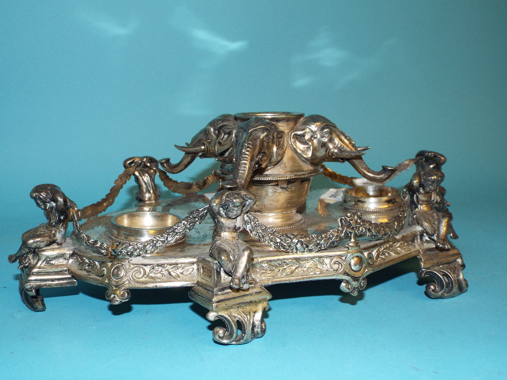 A Victorian silver plated ink stand, the central well with four elephant masks, flanked by a pair of - Image 5 of 9