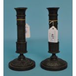 A pair of 19th century bronze candlesticks, 17.