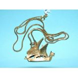 A yellow coloured metal pendant, in the form of a ship, on an 18ct gold chain Condition report