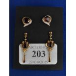 A pair of 9ct gold and garnet drop earrings,