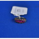 A yellow coloured metal and five stone ruby ring Condition report Report by NG

Total weight