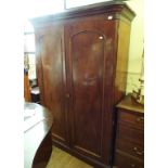 A Victorian mahogany linen press, having a pair of panel doors enclosing trays and drawers,