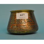 An Islamic brass pot, with silver and copper inlay, 7.