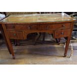 A mahogany bow front kneehole table, 106 cm wide, and an Edwardian inlaid mahogany bookcase,