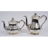 A Victorian silver coffee pot, crested and engraved a motto, with engraved decoration, and a