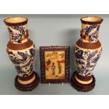 A pair of blue and white pottery vases, decorated insects, flowers and foliage, 30.