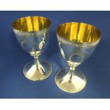 A pair of George III style silver goblets, with engraved decoration, London 1969, approx. 12.4