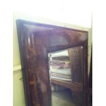 A large wall mirror, with an oyster cut style veneer, 116 x 156 cm Condition report Report by