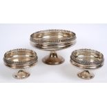 A silver pedestal bowl, 22 cm diameter, and two matching smaller bowls, 13.