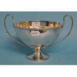 A silver two handled pedestal bowl, Birmingham 1912, approx. 27.5 ozt (patch repair), 18.