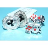 A pair of silver cufflinks, in the form of die,