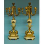 A pair of gilt metal and alabaster candelabra,