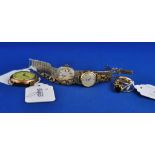A lady's 9ct gold wristwatch, two other watches,