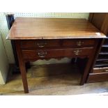 A George III mahogany lowboy, 76.