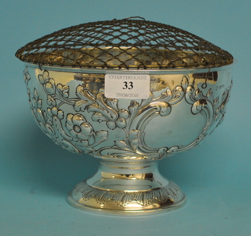 A silver pedestal rose bowl, with rococo style embossed decoration, London 1909, approx. 12.