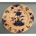 A 19th century Delft plate, decorated flowers and foliage in underglaze blue, 35.