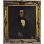 English school, 19th century, a half length portrait of a gentleman seated, oil on canvas,