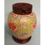 A Chinese famille rose ginger jar, 21 cm high, with wooden cover and stand Condition report Report