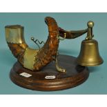 A late Victorian/Edwardian ram's horn table snuff compendium, with a bell, on an oak base,