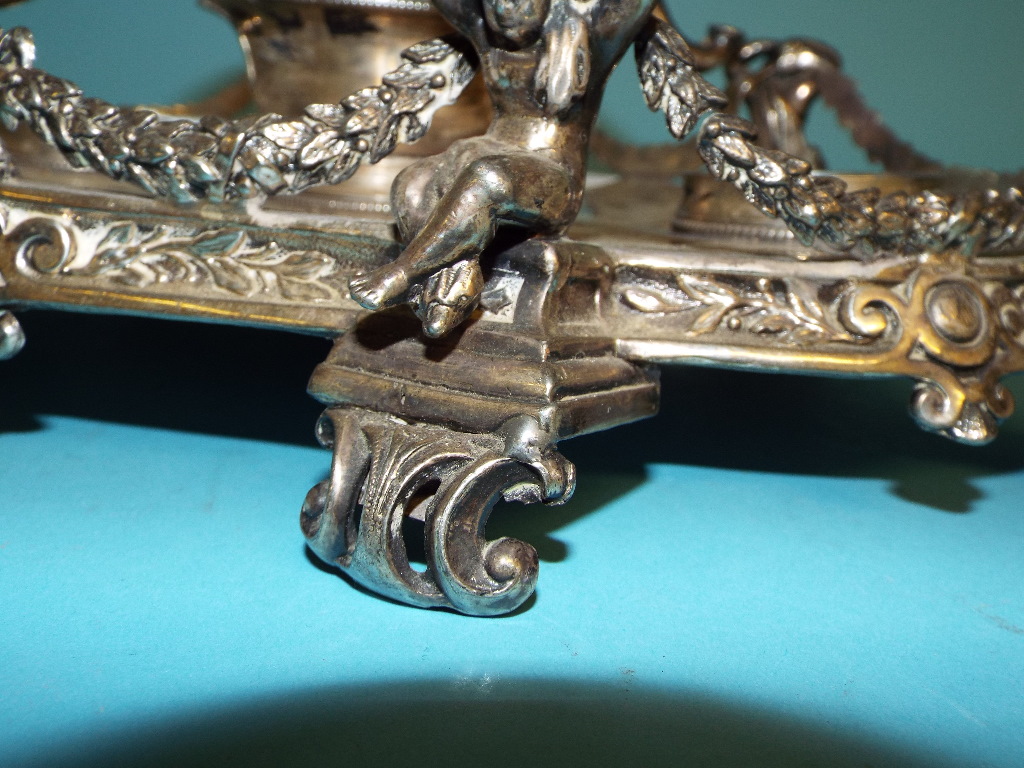 A Victorian silver plated ink stand, the central well with four elephant masks, flanked by a pair of - Image 6 of 9