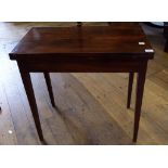 A mahogany card table, on tapering square legs,