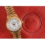 A lady's 18ct gold Rolex Oyster Perpetual Datejust wristwatch, the white dial with Roman numerals,