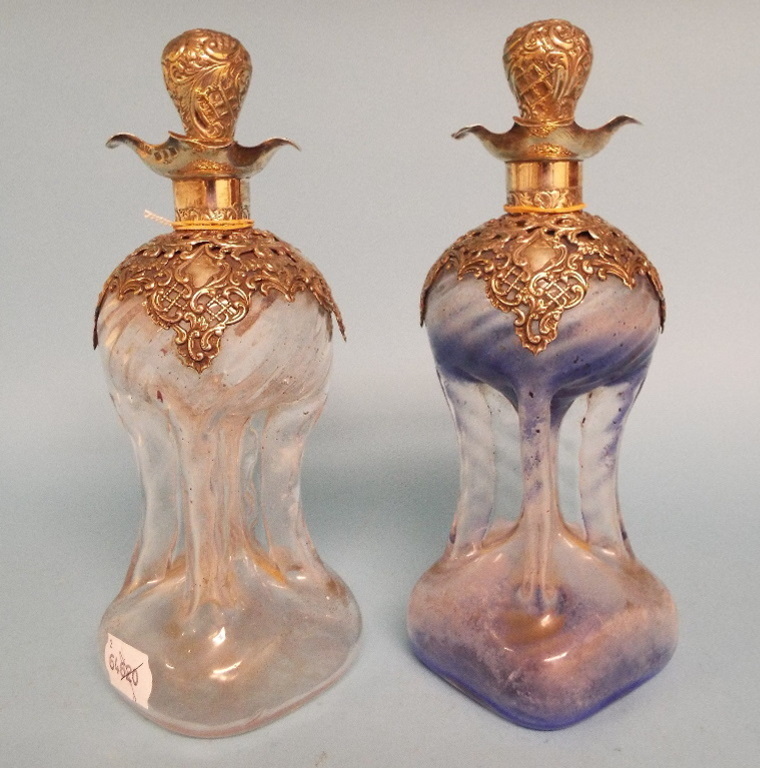 A pair of Victorian silver mounted glass decanters and stoppers, Birmingham 1898 and 1899, 24 cm