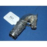 A silver coloured metal walking cane handle,