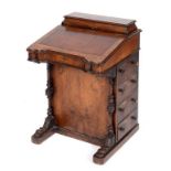 A late Victorian inlaid walnut davenport,