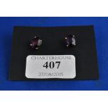 A pair of 18ct gold and amethyst stud earrings,