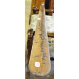 A large olivewood paper knife, painted flowers and inscribed Nice,