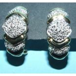 A pair of 9ct gold and diamond earrings