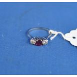 An 18ct white gold, ruby and diamond rin